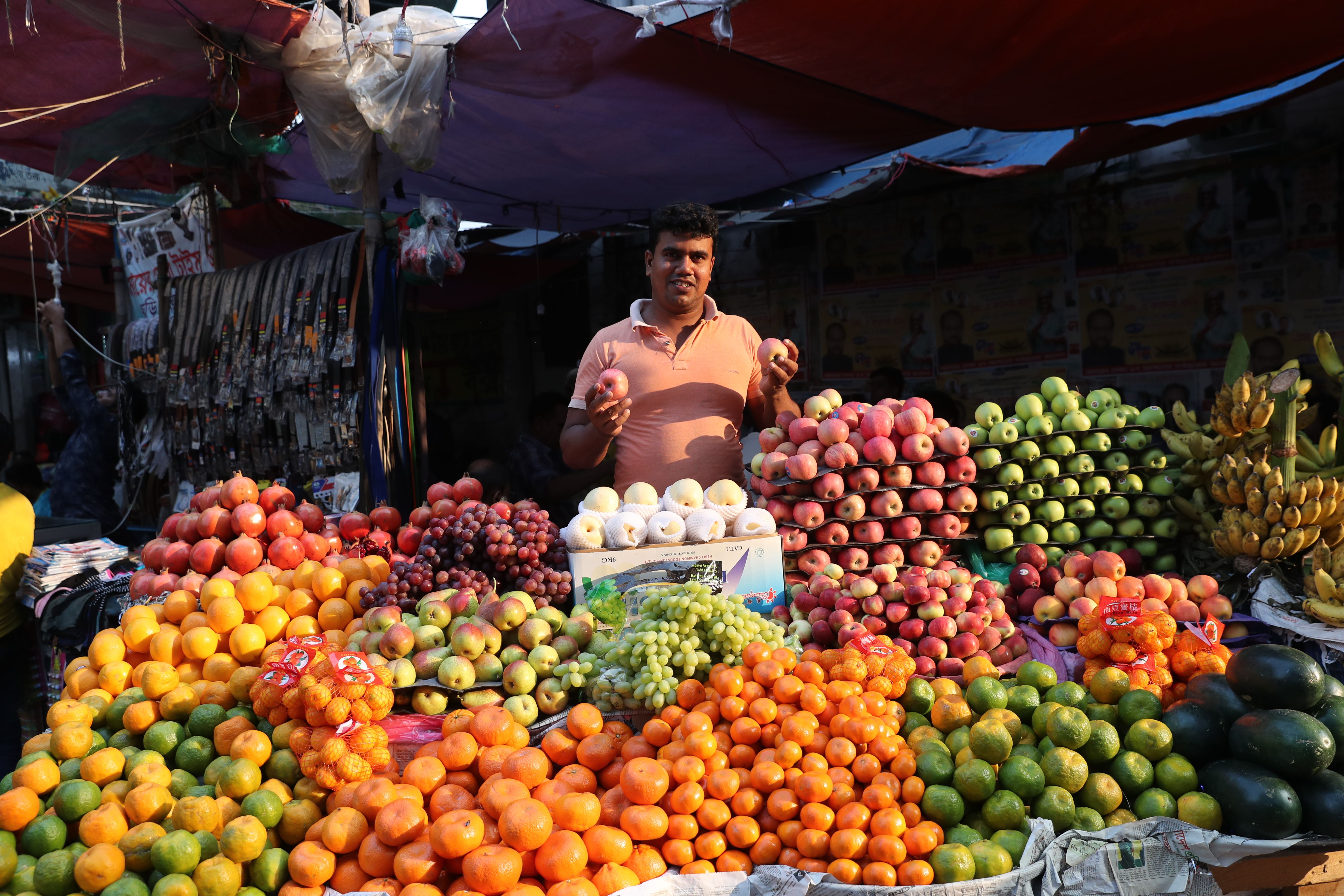 a man selling fruits
