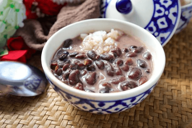 A bowl of white rice and red beans.