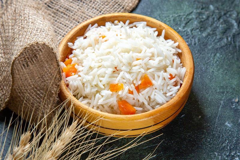 A bowl of white rice, a dominant staple in South Asia.