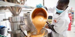 Man pouring peanut butter